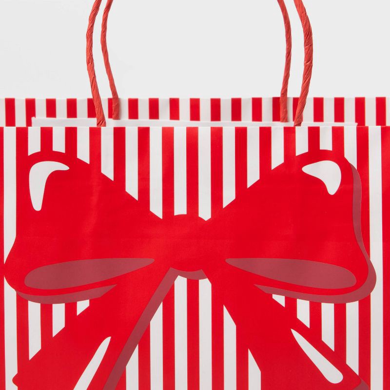 slide 3 of 3, XL Striped Bow Christmas Gift Bag Red/White - Spritz™, 1 ct