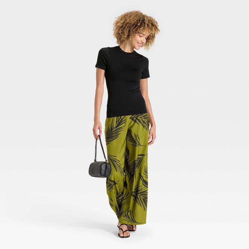 slide 3 of 4, Women's Slim Fit Seamless Short Sleeve T-Shirt - A New Day™ Black S, 1 ct