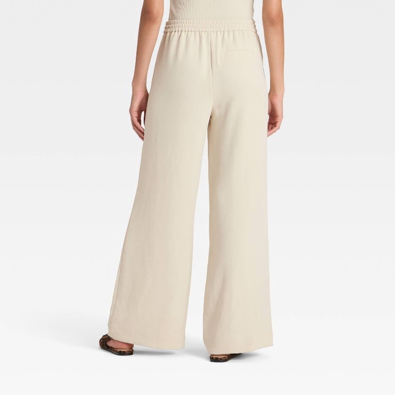 slide 2 of 3, Women's Wide Leg Signature Crepe Pull-On Pants - A New Day™ Cream S, 1 ct