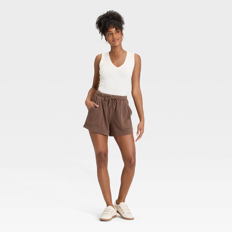 slide 3 of 3, Women's Mid-Thigh Fleece Shorts - Universal Thread™ Brown S, 1 ct