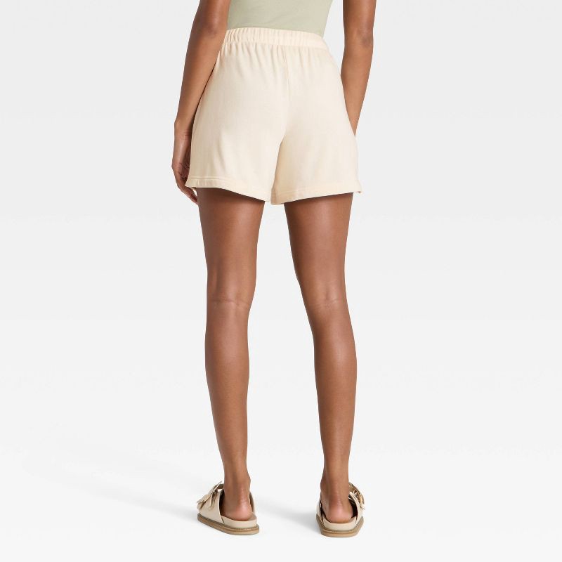 slide 2 of 3, Women's Mid-Thigh Fleece Shorts - Universal Thread™ Cream XS, 1 ct