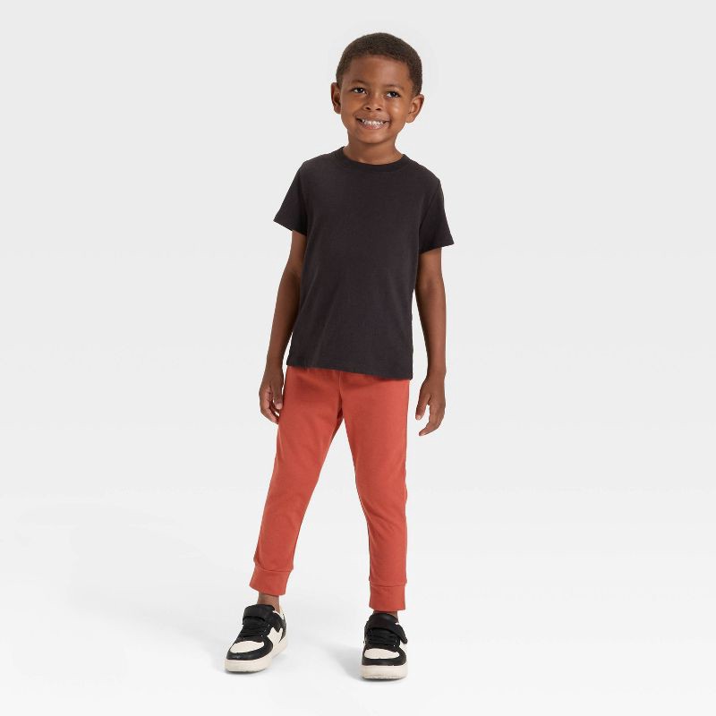 slide 3 of 3, Toddler Boys' Solid Jersey Jogger Pants - Cat & Jack™ Copper Orange 3T, 1 ct