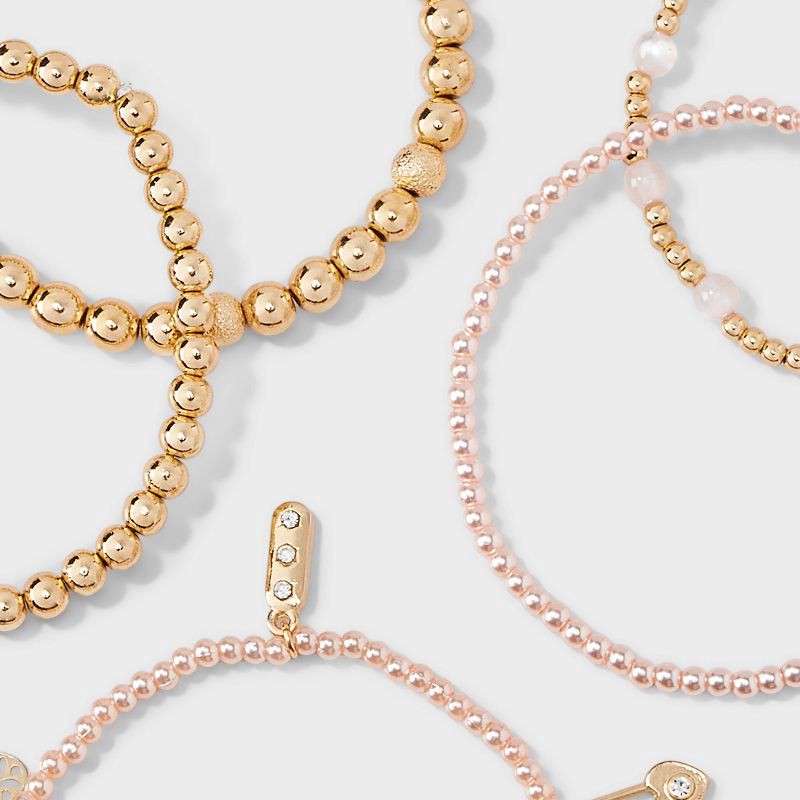 slide 5 of 5, Mixed Beaded and Charm Bracelet Set 5pc - Wild Fable™ Light Pink/Gold, 5 ct