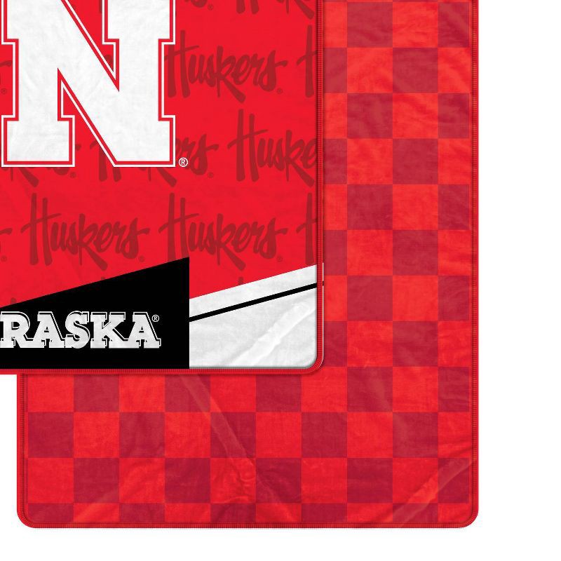 slide 2 of 3, NCAA Nebraska Cornhuskers Diagonal Ghost Checker Double Sided Blanket, 1 ct