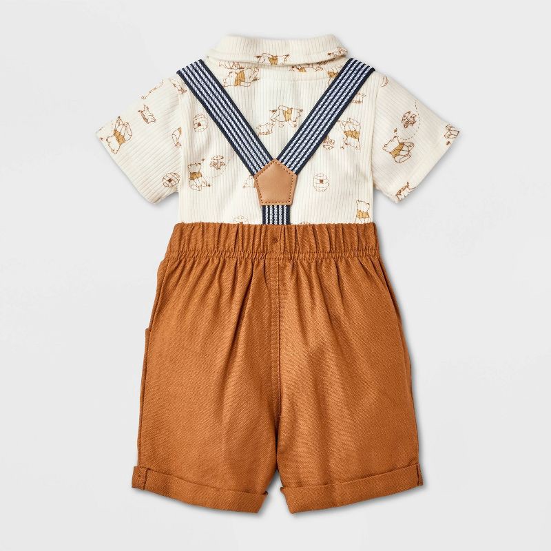 slide 2 of 4, Baby Boys' 2pc Disney Winnie the Pooh Short Sleeve Bodysuit & Shorts Suspender Set - Brown Newborn, 2 ct