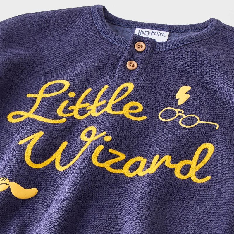slide 3 of 4, Baby Boys' 2pc Harry Potter 'Little Wizard' Printed Pullover Sweatshirt and Bottom Set - Navy Blue 0-3M, 2 ct