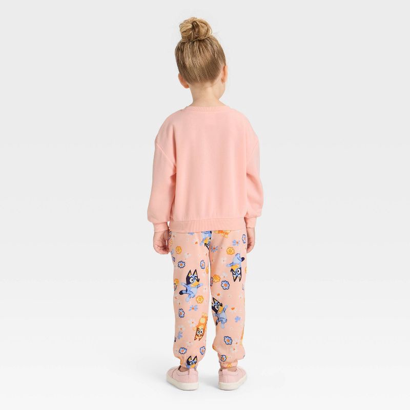 slide 2 of 4, Toddler Girls' 2pc Bluey Bingo Floral Cozy Fleece Sweatshirt with Tulle Bow and Pants Set - Peach Orange 5T, 2 ct