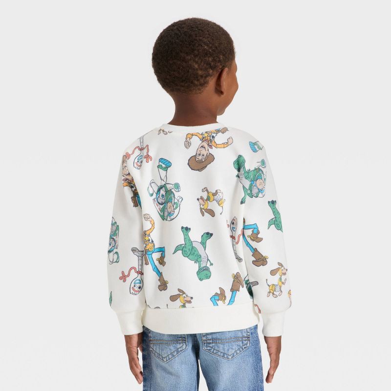 slide 3 of 4, Toddler Boys' Disney Toy Story Fleece Sweatshirt - Off-White 5T, 1 ct
