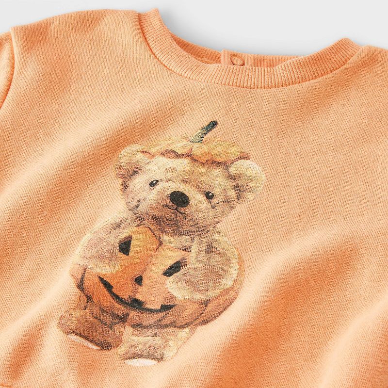 slide 2 of 4, Grayson Mini Baby 2pc Teddy Bear Halloween Pumpkin Pullover & Checkered Bottom Set - Orange 18M, 2 ct
