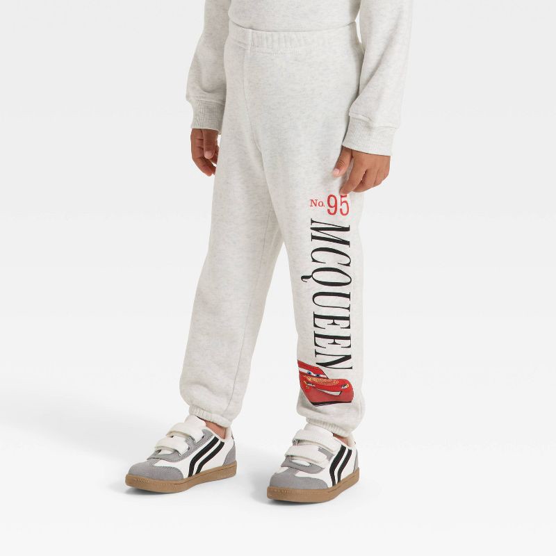 slide 4 of 4, Toddler Boys' 2pc Disney Cars Fleece Pullover and Bottom Set - Oatmeal 4T, 2 ct