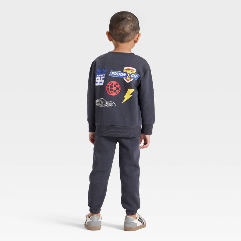 slide 2 of 4, Toddler Boys' 2pc Disney Cars Lightning McQueen Racing Fleece Pullover and Bottom Set - Black 3T, 2 ct