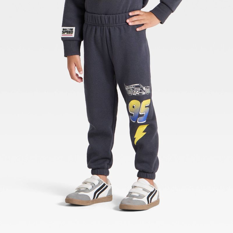 slide 4 of 4, Toddler Boys' 2pc Disney Cars Lightning McQueen Racing Fleece Pullover and Bottom Set - Black 3T, 2 ct