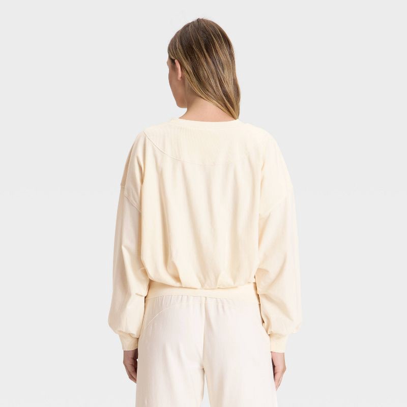 slide 2 of 3, Women's Bubble Hem Long Sleeve Top - JoyLab™ Cream M, 1 ct
