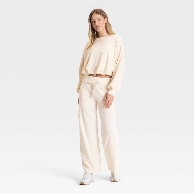 slide 3 of 3, Women's Bubble Hem Long Sleeve Top - JoyLab™ Cream M, 1 ct