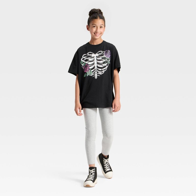 slide 3 of 4, Mad Engine Girls' Floral Ribcage Short Sleeve Oversized Graphic T-Shirt - Black L, 1 ct