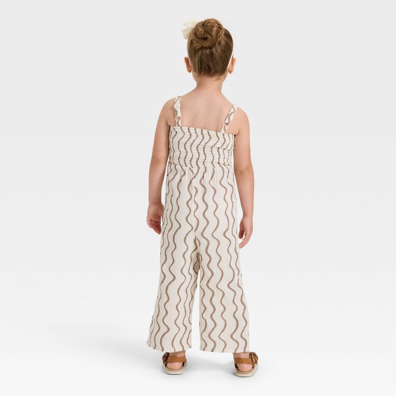 slide 2 of 3, Grayson Mini Toddler Girls' Smocked Wavy Striped Printed Jumpsuit - Cream/Brown 18M, 1 ct