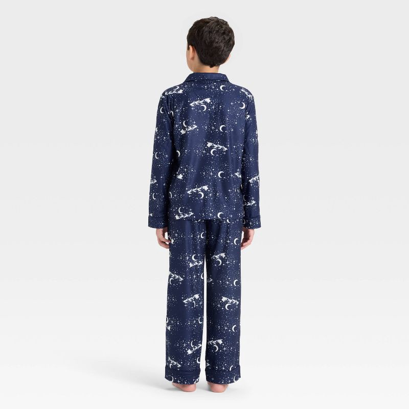 slide 2 of 4, Boys' 2pc Christmas Santa Sleigh Long Sleeve Button-Down Pajama Set - Cat & Jack™ Navy Blue XS, 2 ct