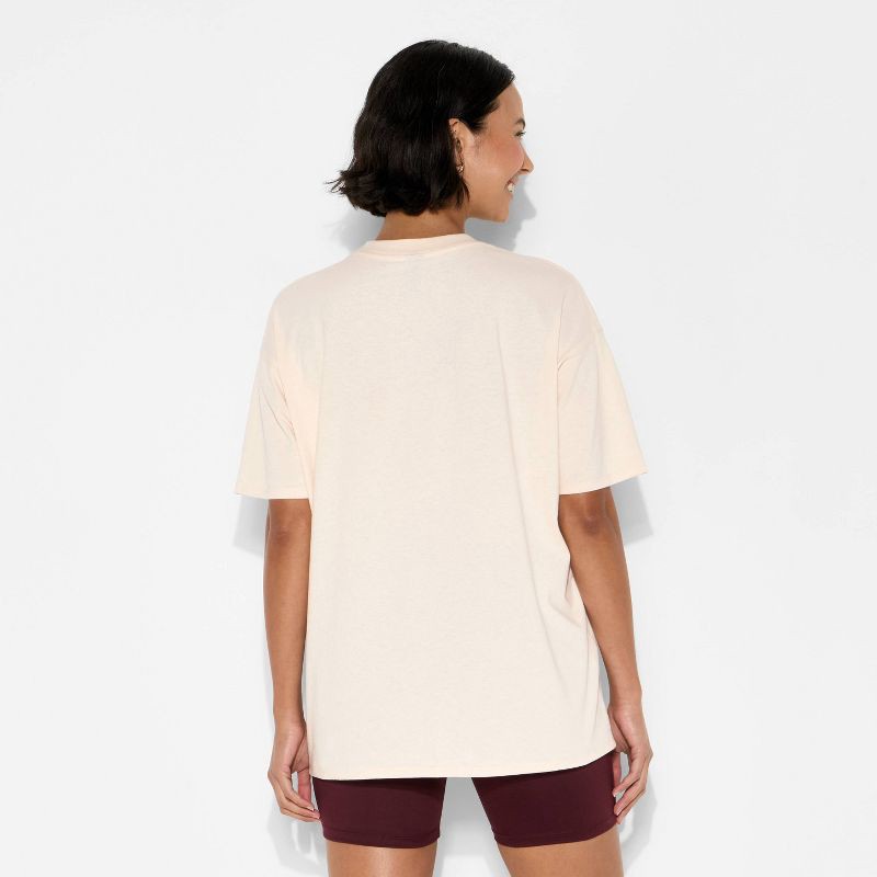 slide 3 of 4, Women's Loose Fit Short Sleeve Crewneck Oversized Graphic T-Shirt - Wild Fable™ Beige Lips M, 1 ct