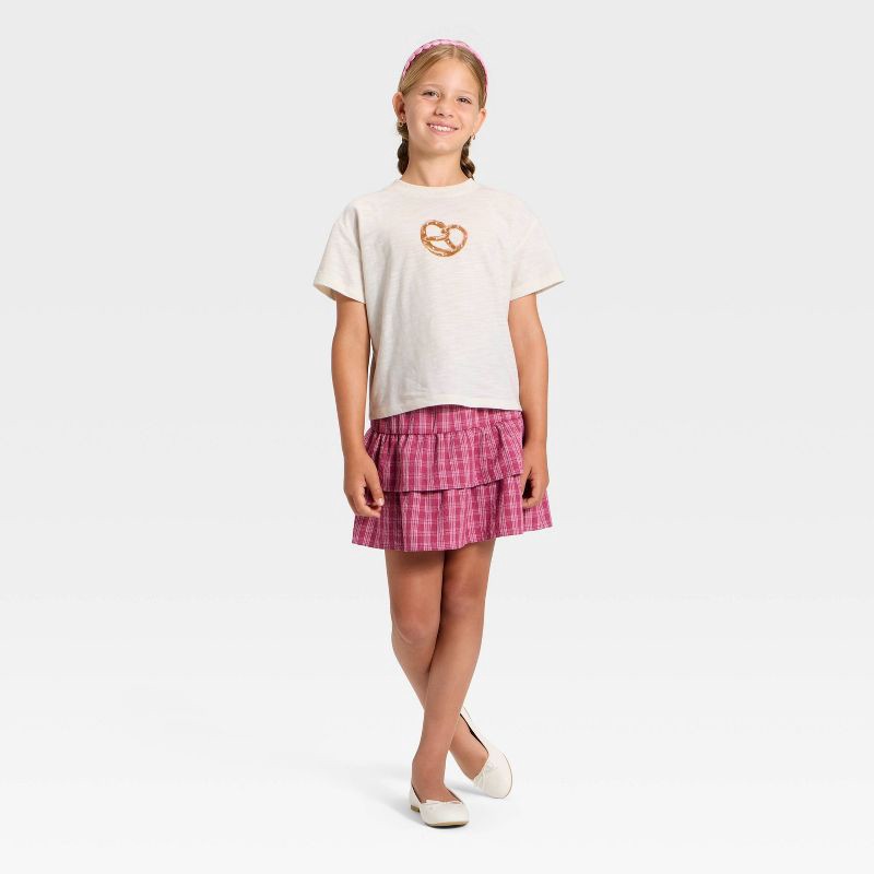 slide 4 of 4, Girls' Short Sleeve Pretzel Relaxed Fit Graphic T-Shirt - Cat & Jack™ Cream XL, 1 ct