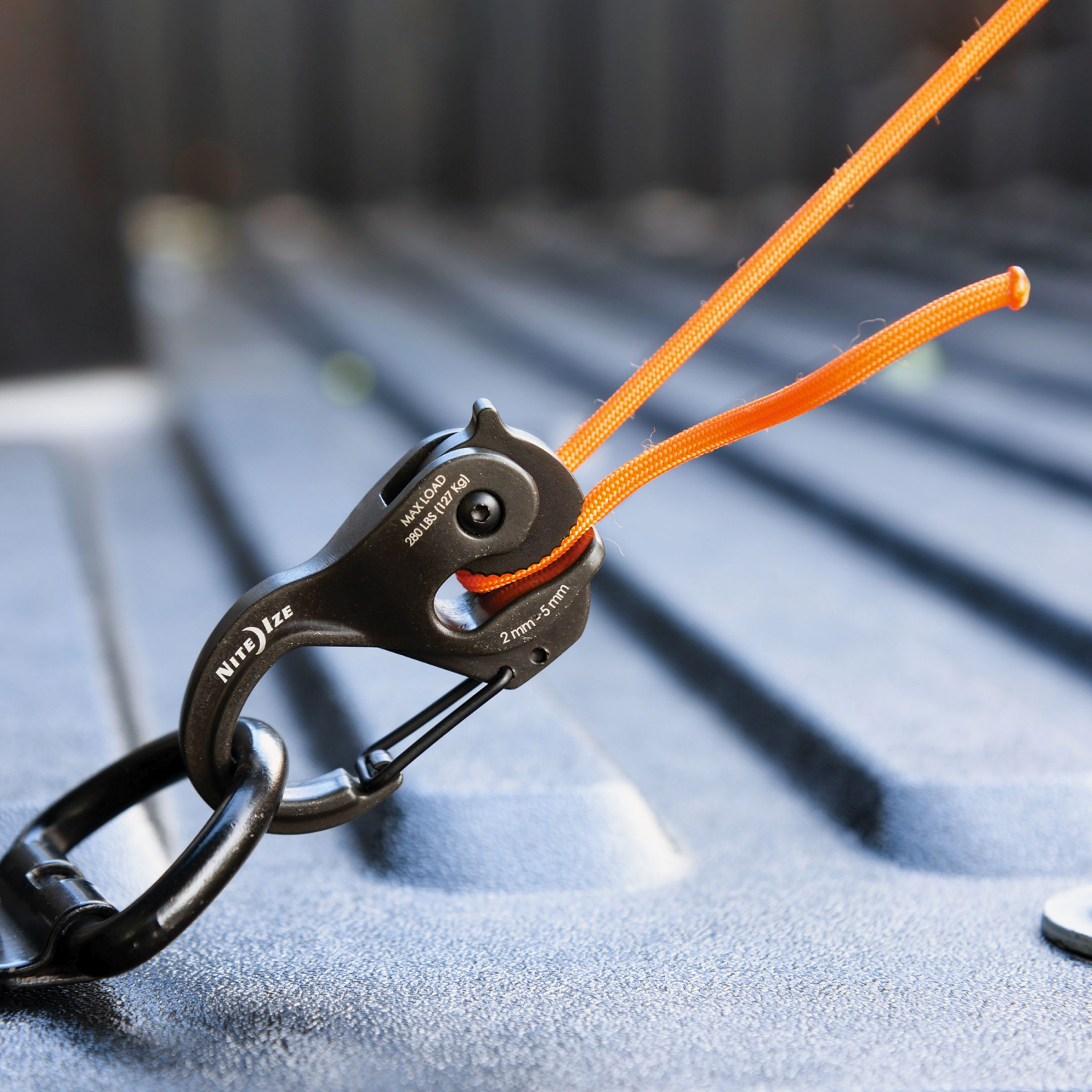 slide 7 of 8, NITE IZE CamJam Xt Aluminum Cord Tightener, SM