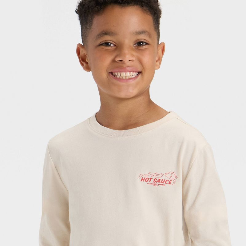 slide 2 of 4, Boys' Long Sleeve 'Hot Sauce' Graphic T-Shirt - Cat & Jack™ Beige L, 1 ct
