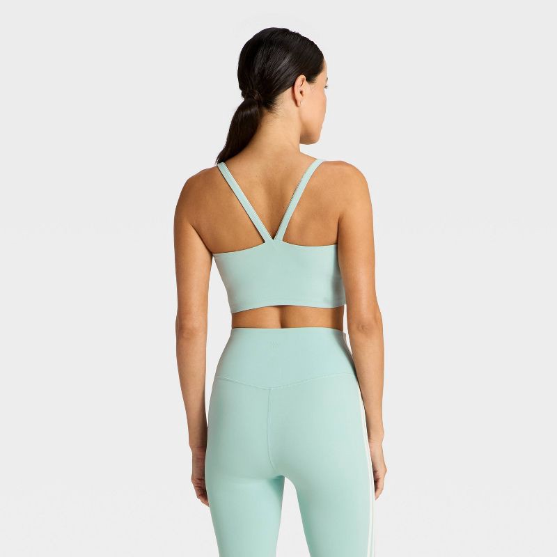 slide 2 of 5, Women's Everyday Soft Light Support Velour Piped Sports Bra - All In Motion™ Light Blue XS, 1 ct