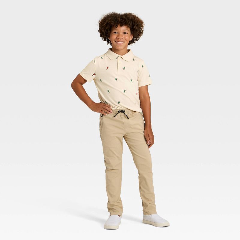 slide 2 of 3, Boys' Short Sleeve Holiday Printed Polo Shirt - Cat & Jack™ Beige XS, 1 ct