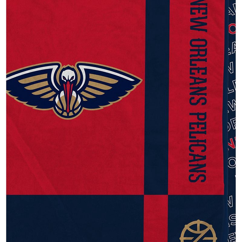 slide 2 of 3, NBA New Orleans Pelicans 60"x70" Reverse Block Wordmark Double Sided Flannel Fleece Blanket, 1 ct