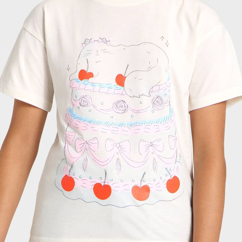 slide 2 of 4, Girls' Short Sleeve 'Cat Cake' Oversized Graphic T-Shirt - Cat & Jack™ Off-White M, 1 ct
