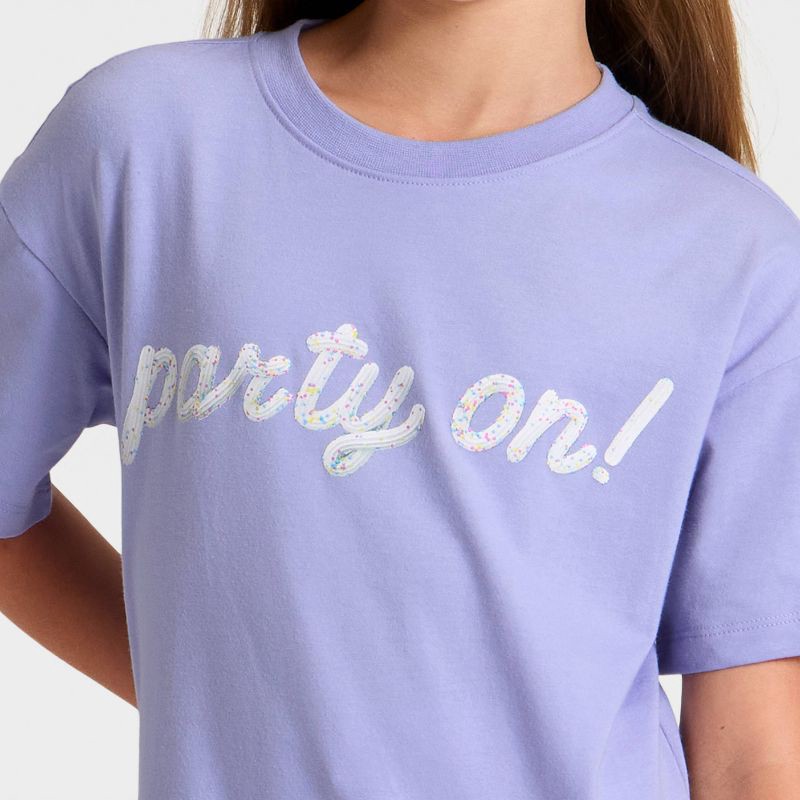 slide 2 of 4, Girls' Short Sleeve 'Party On' Oversized Graphic T-Shirt - Cat & Jack™ Purple S, 1 ct