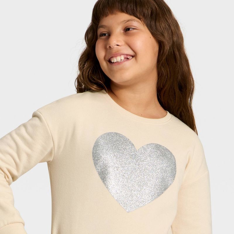 slide 2 of 4, Girls' Fleece 'Glitter Heart' Graphic Pullover Sweatshirt - Cat & Jack™ Cream XS, 1 ct