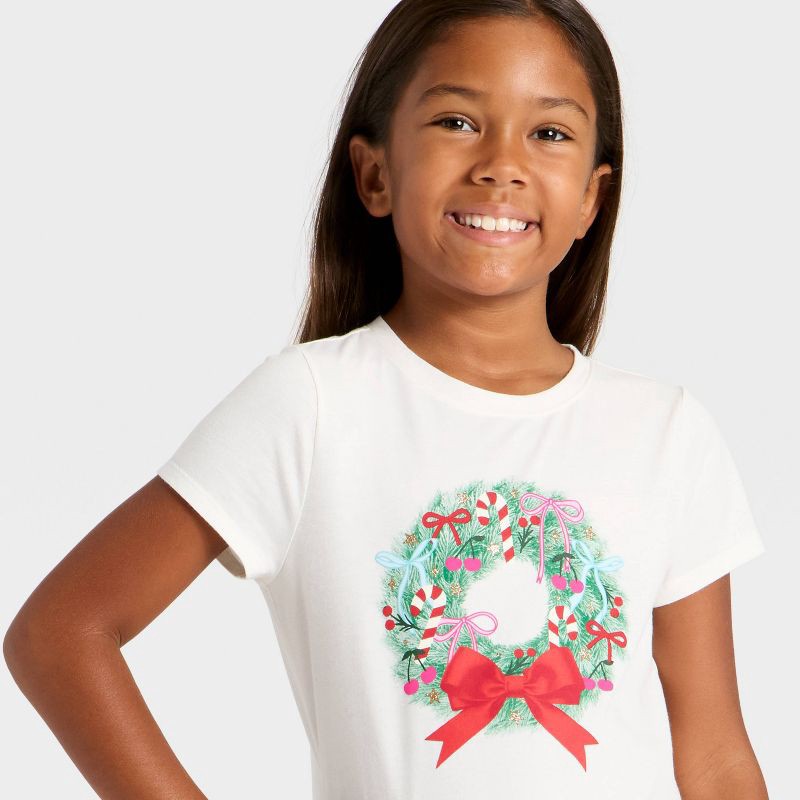 slide 2 of 4, Girls' Short Sleeve Christmas 'Wreath' Graphic T-Shirt- Cat & Jack™ Cream L, 1 ct