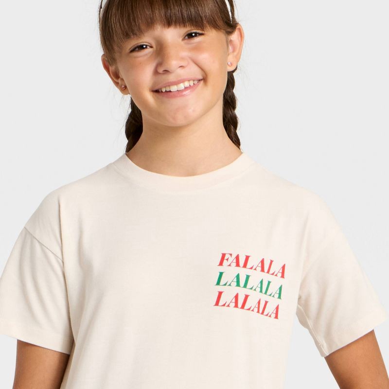slide 2 of 4, Girls' Short Sleeve Christmas 'Falala' Oversized Graphic T-Shirt- Cat & Jack™ Beige L, 1 ct