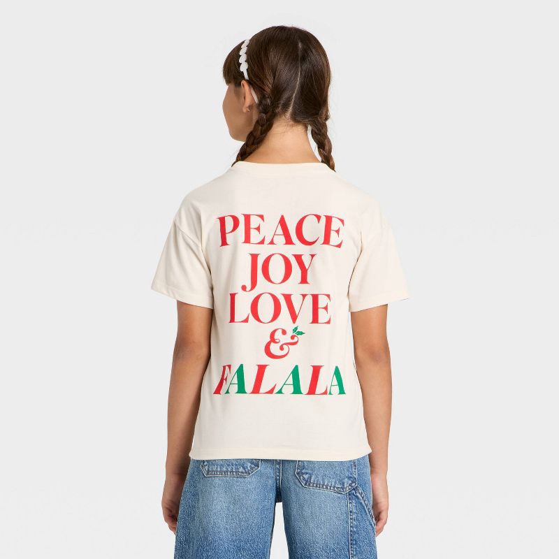 slide 3 of 4, Girls' Short Sleeve Christmas 'Falala' Oversized Graphic T-Shirt- Cat & Jack™ Beige L, 1 ct