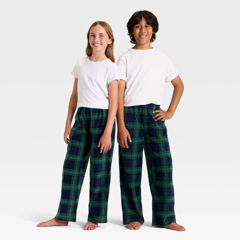 slide 1 of 4, Kids' Plaid Microfleece Holiday Matching Family Pajama Pants - Wondershop™ Navy Blue S, 1 ct