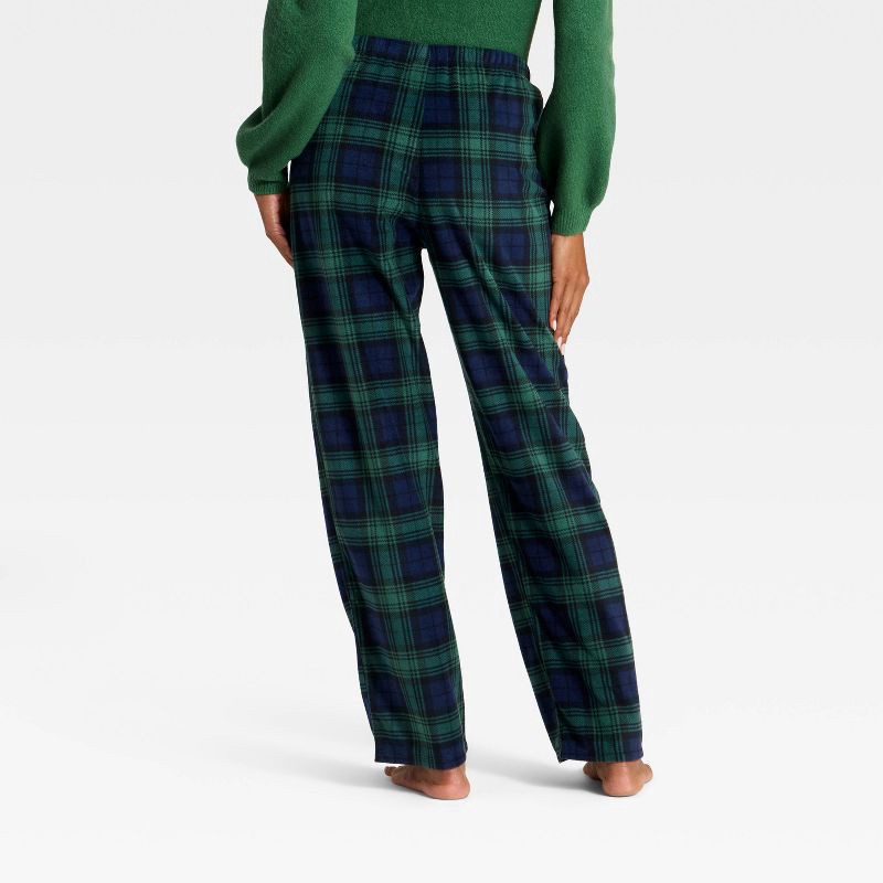 slide 2 of 4, Women's Plaid Microfleece Holiday Matching Family Pajama Pants - Wondershop™ Navy Blue S, 1 ct