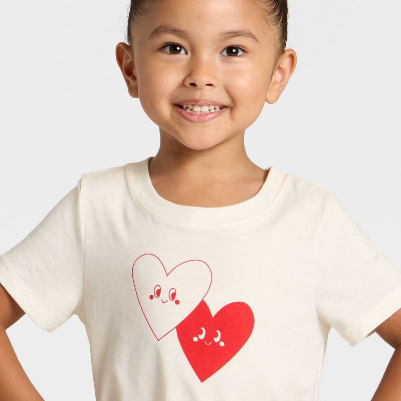 slide 2 of 4, Toddler Girls' Short Sleeve Hearts Graphic T-Shirt - Cat & Jack™ Cream 4T, 1 ct