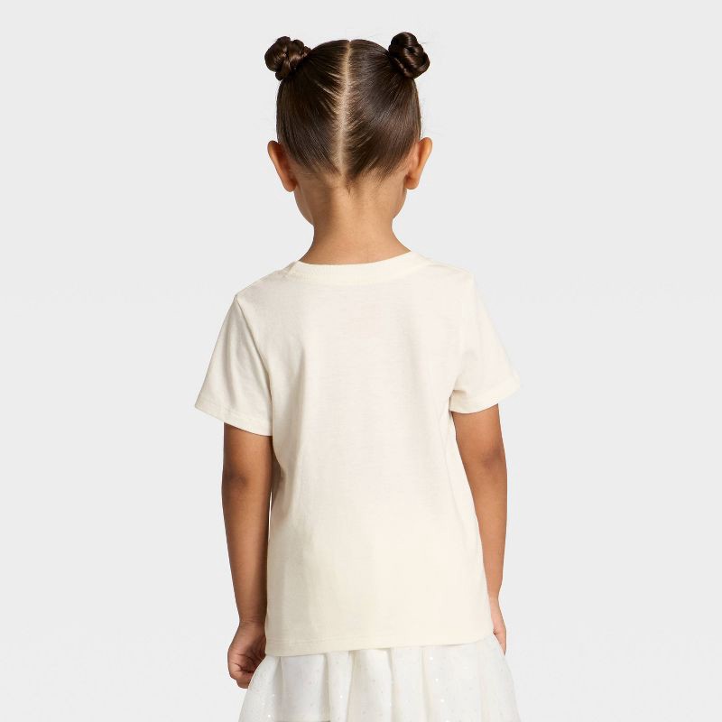 slide 3 of 4, Toddler Girls' Short Sleeve Hearts Graphic T-Shirt - Cat & Jack™ Cream 5T, 1 ct