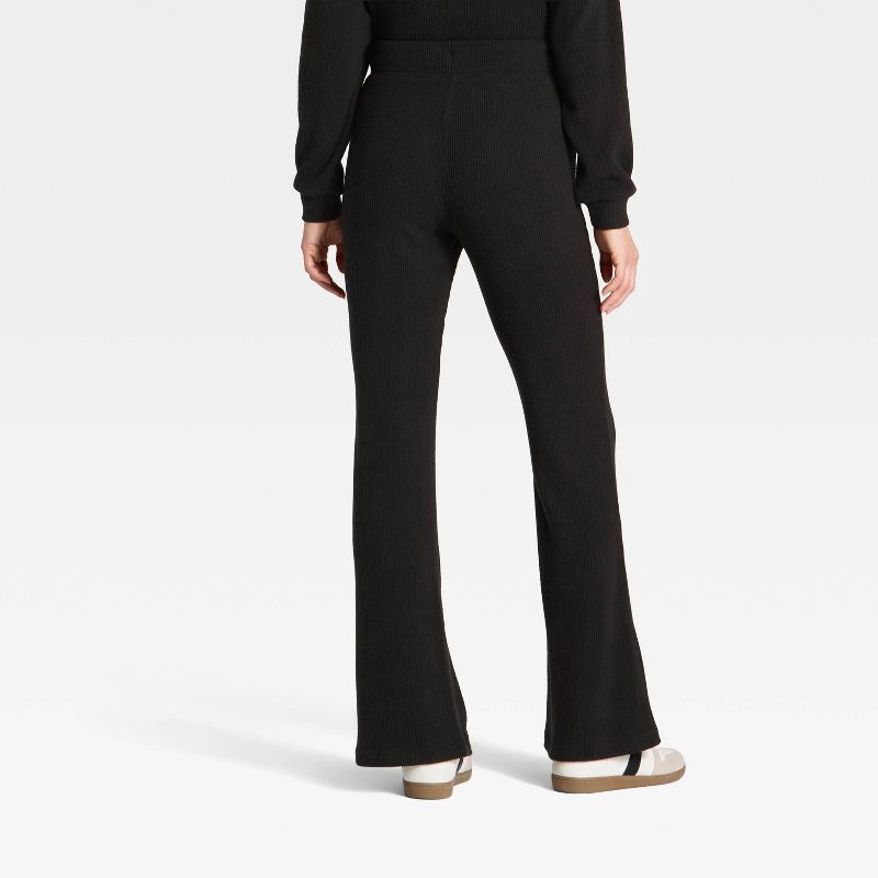 slide 2 of 3, Women's Mid-Rise Ribbed Flare Pants - Universal Thread™ Black M, 1 ct