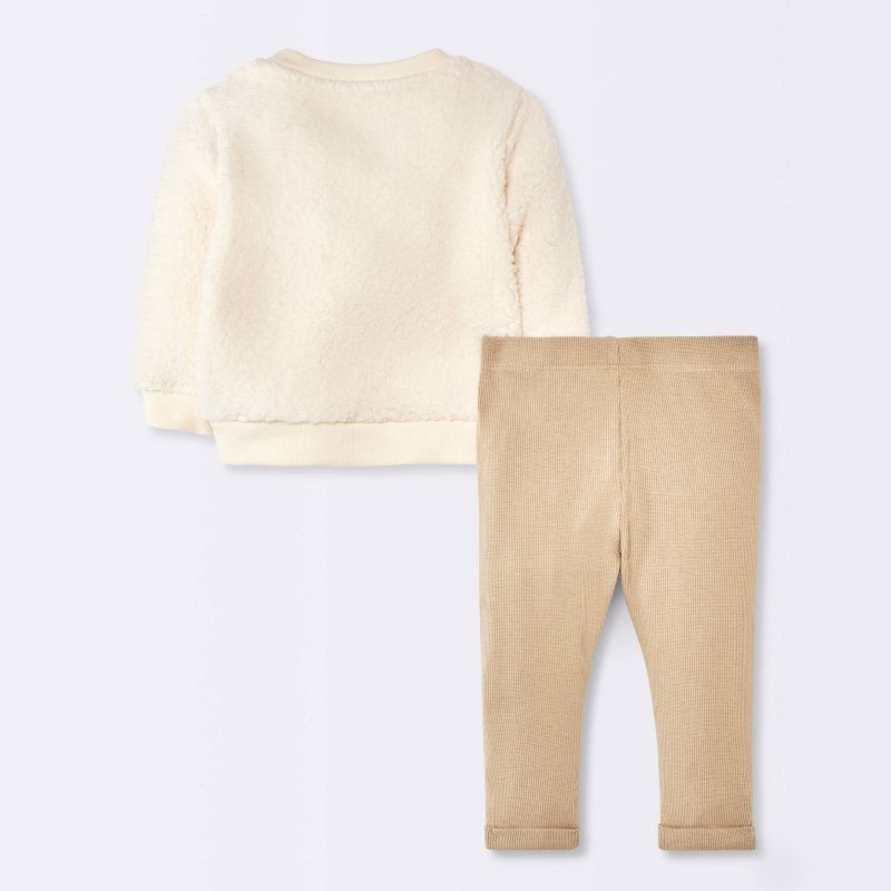 slide 2 of 4, Baby Boys' 2pc Bear Faux Shearling Sweatshirt and Ribbed Pants Set - Cloud Island™ Cream Newborn, 2 ct