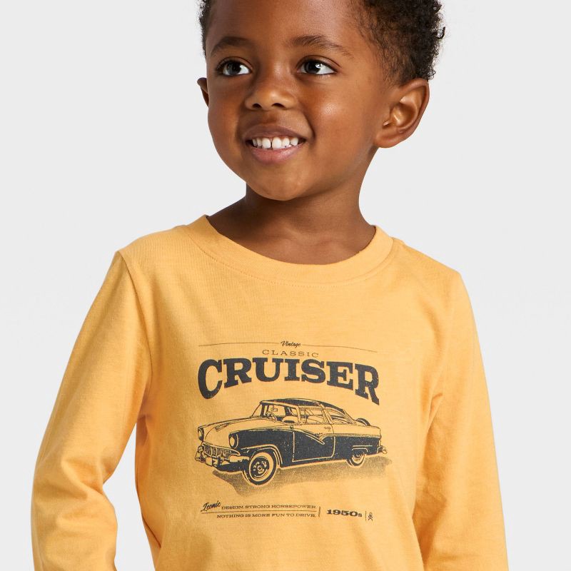 slide 3 of 4, Toddler Boys' Long Sleeve Cruiser Graphic T-Shirt - Cat & Jack™ Gold 2T, 1 ct