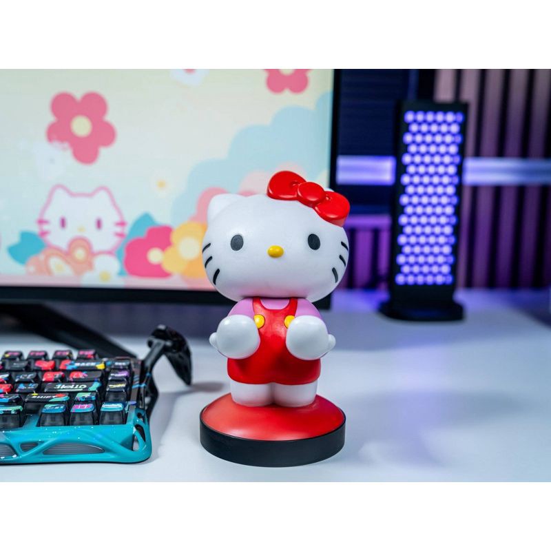 slide 5 of 8, Hello Kitty Cable Guy Phone and Controller Holder, 1 ct