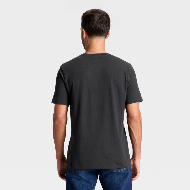 slide 2 of 3, Men's Short Sleeve Sleigh World Tour Graphic Shirt - Goodfellow & Co™ Black XL, 1 ct