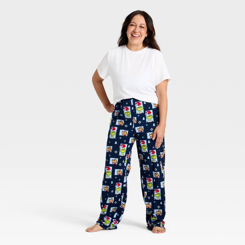 slide 3 of 4, Women's The Grinch Print Fleece Holiday Matching Family Pajama Pants - Navy Blue XS, 1 ct