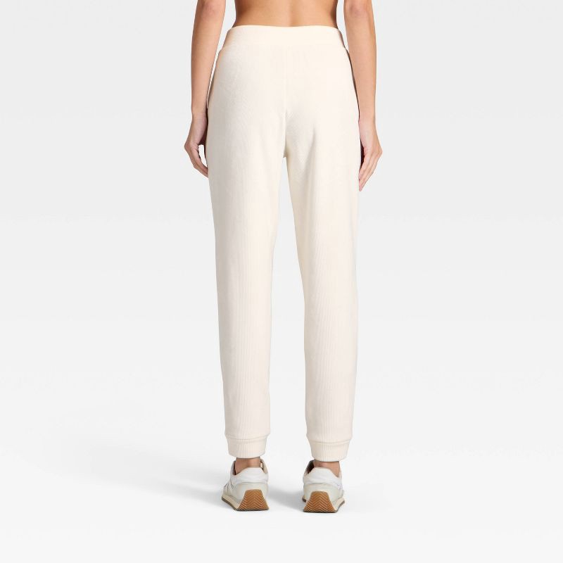 slide 2 of 5, Women's Velour Ribbed Jogger Sweatpants - All In Motion™ Cream M, 1 ct