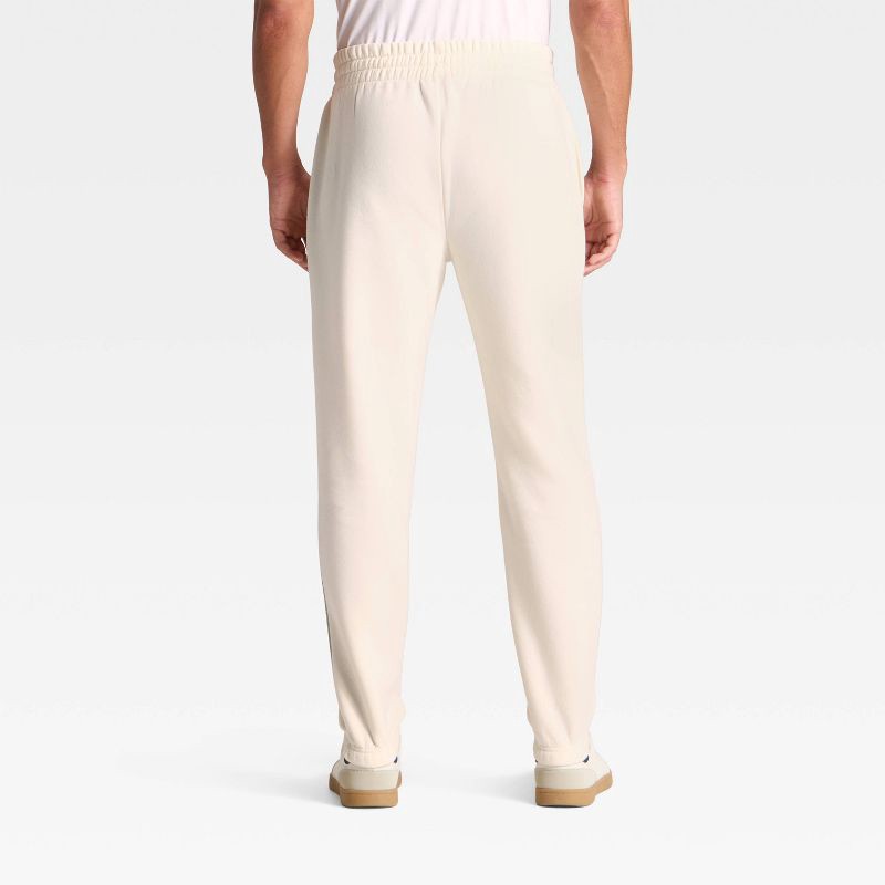 slide 3 of 3, Adult The Grinch Fleece Graphic Joggers - Cream XL, 1 ct