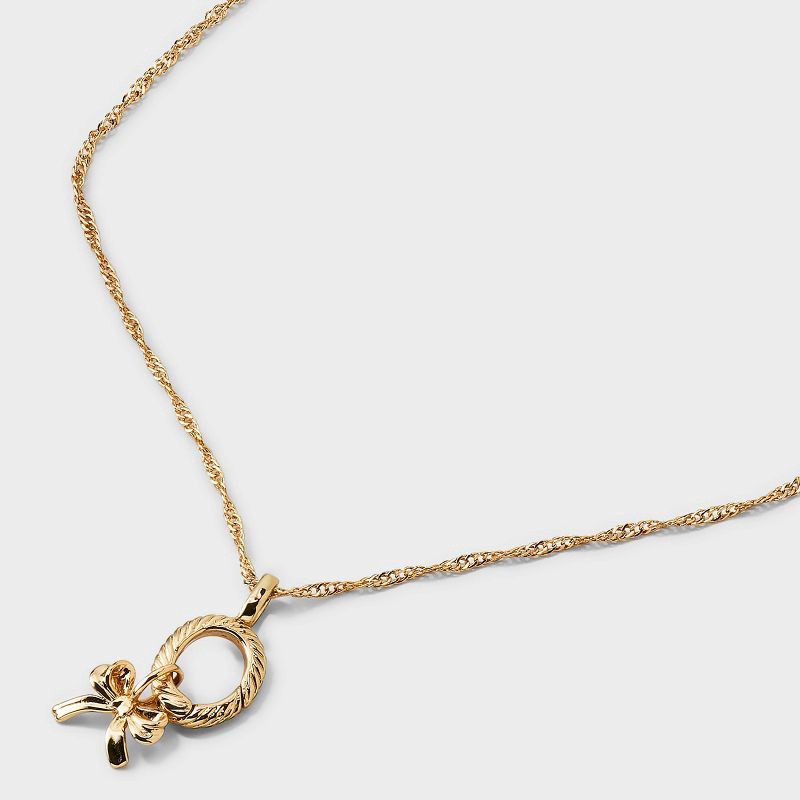slide 4 of 4, 14K Gold Dipped Cubic Zirconia Bow Pendant Charm Necklace Set 5pc - A New Day™ Gold, 5 ct