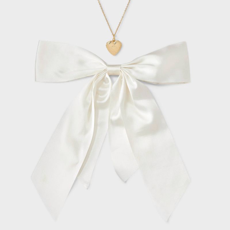 slide 2 of 5, Bow Hair Clip and Necklace with Heart Charm Set 2 pc - Wild Fable™ Ivory, 2 ct