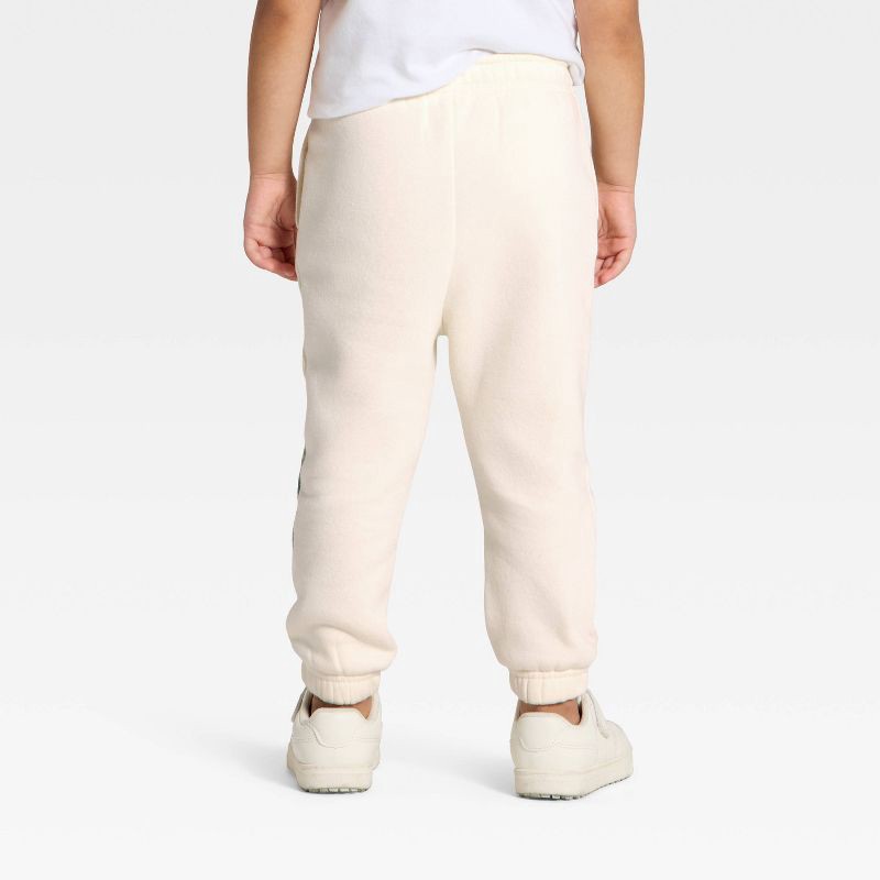slide 3 of 3, Toddler The Grinch Fleece Joggers - Cream 18M, 1 ct