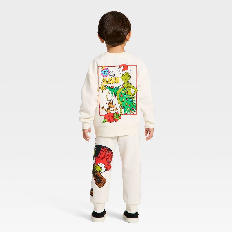 slide 2 of 4, Toddler Boys' 2pc The Grinch Christmas Fleece Sweatshirt and Jogger Set - Cream 3T, 2 ct